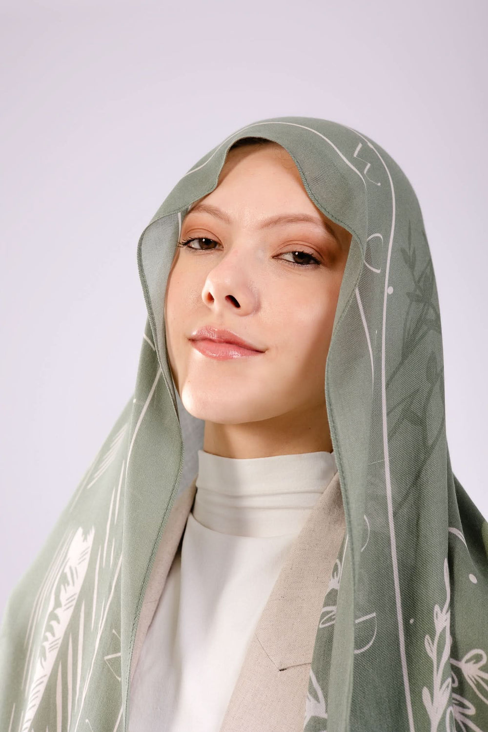 worood Lightweight olive modal scarf highlighting fluid movement and refined finish.